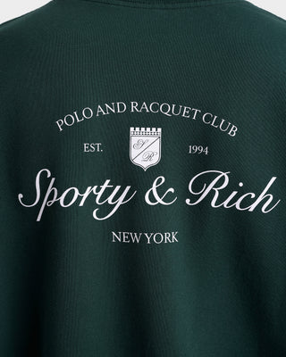Dark green t-shirt with 'Polo and Racquet Club' and 'Sporty & Rich New York' text on a white background