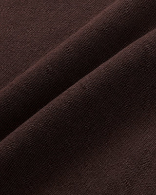 Close-up of brown fabric with a subtle texture