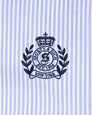 Sporty & Rich logo on a striped background