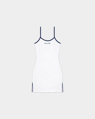 Rosa Signature Logo Sports Dress in White/Dark Navy—a white sleeveless mini tennis dress with spaghetti straps, navy trim, small signature script on the chest, and a built-in bodysuit; an absolute court essential shown laid flat.