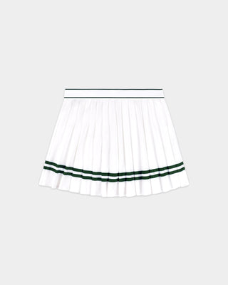 The Ally Serif Logo Pleated Skirt - White/Forest features crisp pleats and green forest stripes near the hem, with Sporty & Rich text on the elastic waistband and comfortable built-in shorts for ease of movement.
