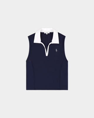 The Fanny SRC Sports Polo Vest in dark navy and white is a cropped, sleeveless polo featuring classic tennis styling with a white collar and a small white embroidered logo on the left chest, crafted from technical stretch fabric for comfort and ease of movement.