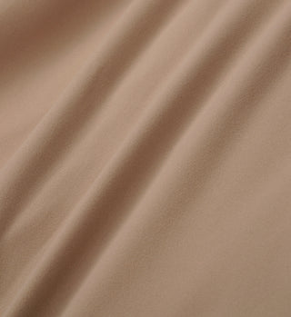 Close-up of soft, light brown fabric with gentle folds and a smooth texture, ideal for crafting the Runner Legging - Espresso/White.