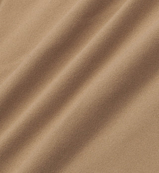 Close-up of Earl Gray Runner Script Sports Bralette: light brown fabric with a soft texture and diagonal folds, highlighting its comfort.