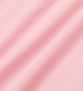 Experience the Serif Logo Biker Short - Ballet, crafted from soft pink luxurious fabric with a smooth texture and diagonal gentle folds.