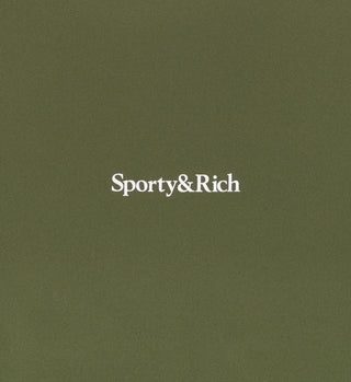 Centered white Sporty & Rich serif logo on a solid moss background, inspired by the premium fabric of our Serif Logo High Waisted Legging – Moss/White.