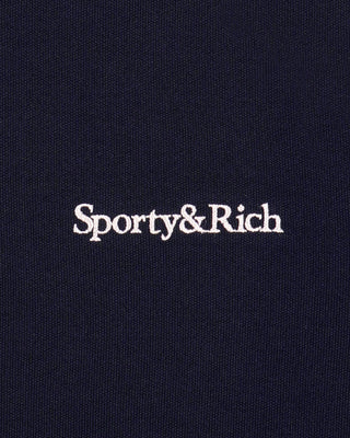 Close-up of 'Sporty&Rich' logo on a black background