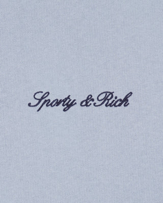 Light blue fabric with 'Sporty & Rich' embroidery