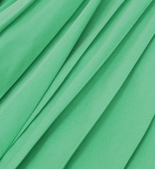 Close-up of the Prince Sporty Pleated Skirt - Clean Mint/White fabric, showcasing its smooth folds and soft texture—ideal for a stylish tennis skirt.
