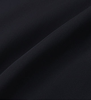 Close-up of black fabric with a soft, textured surface showing gentle folds and shadows, reminiscent of the sleek design found in SR Runner Active Short - Black/White with an elastic waistband.