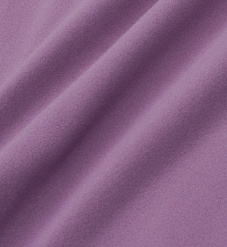 Close-up of luxurious eggplant fabric with soft folds and gentle shadows, capturing the signature feel of the SR Bold Legging - Eggplant/White.