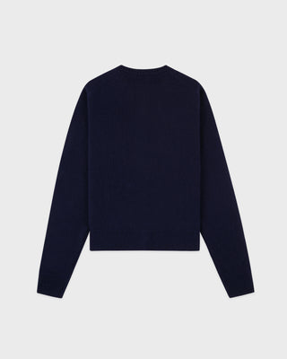 Navy blue sweater on a light gray background