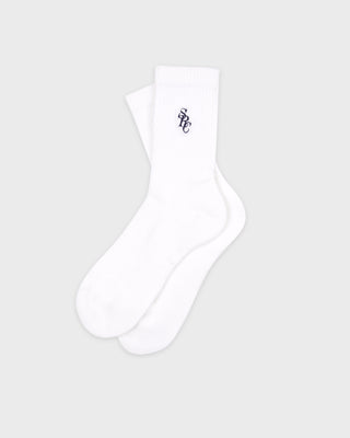 SRC Socks - White/Navy: White crew cotton socks with a navy embroidered SRC logo, folded and wrapped in a white band featuring a circular logo. Made in Portugal.