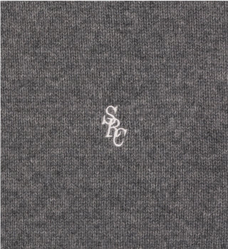 The SRC V-Neck Cashmere Vest - Dark Gray is a cropped knit vest made from 100% cashmere, featuring small white overlapping SPC monogram embroidery at the center.