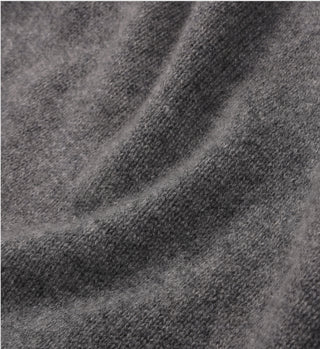 Close-up of the SRC V-Neck Cashmere Vest in Dark Gray, highlighting its soft, textured cashmere fabric with gentle folds and a slightly fuzzy finish.