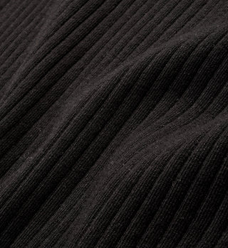 Close-up of the black ribbed fabric and wavy texture, highlighting the Mock Neck Collar detail on the SRHWC Ribbed T-Shirt - Black.