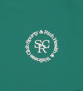 White logo on a teal background