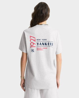 Person wearing a New York Yankees t-shirt with text on the back