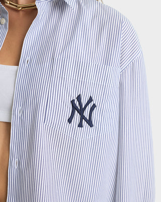 Close-up of a blue and white striped shirt with a logo on a white background