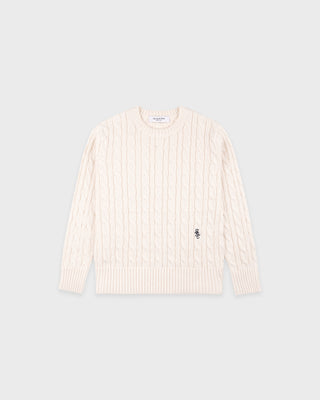 Beige ribbed long-sleeve shirt on a light gray background