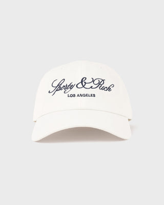 White visor cap with 'Sporty & Rich Los Angeles' text on a white background