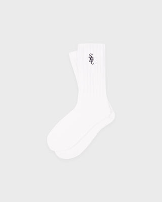 White sock with a small logo on a light gray background