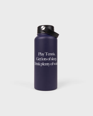 Navy blue water bottle with motivational text on a white background