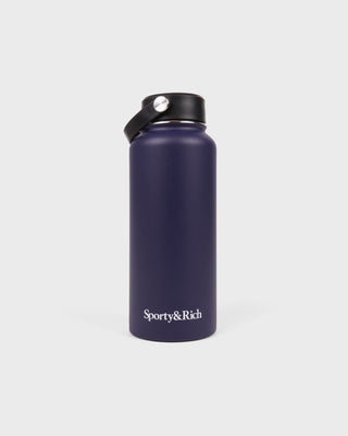 Navy blue water bottle with black lid on a white background