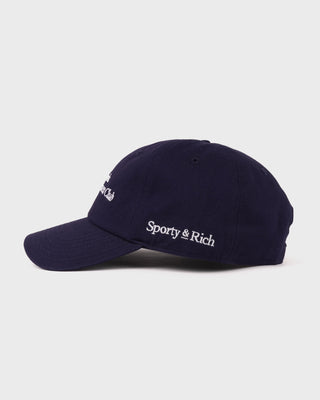 Navy blue cap with 'Sporty & Rich' logo on a light gray background