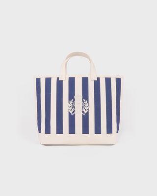 Striped tote bag with a logo on a light gray background