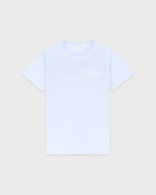 Light blue t-shirt with text on a beige background