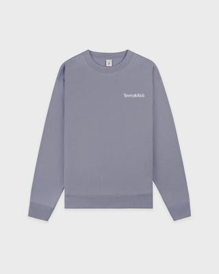 Gray sweatshirt with a brand logo on a light gray background