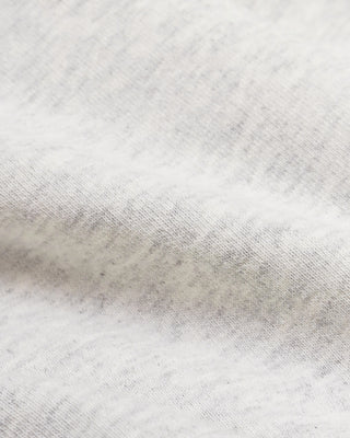 Wellness Ivy Wide Sweatpant in Heather Gray/Light Navy, featuring "WELLNESS" text on the left pocket and crafted from 100% cotton with an elastic waistband, displayed on a plain white background.