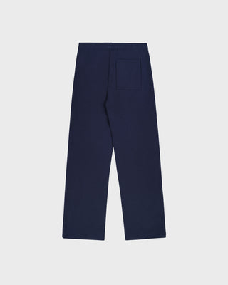 The LA Serif Wide Sweatpant in Dark Navy/White features a wide-leg, oversized fit crafted from 100% cotton and showcases a white LA logo along with Sporty & Rich text on the front, displayed lying flat on a white background.