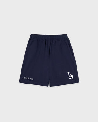 Dodgers Serif Gym Short in Dark Navy/White, featuring LA and Sporty & Rich logos on the front, an elastic waistband, crafted from 100% cotton in Portugal. Presented against a white background.