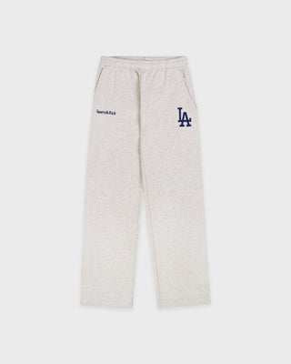 Introducing the LA Serif Wide Sweatpant in Heather Gray/Navy, featuring a wide leg silhouette with navy Sports & Rich and a large LA logo printed on the front. Made from 100% cotton, these sweatpants offer an elastic waistband for ultimate comfort.