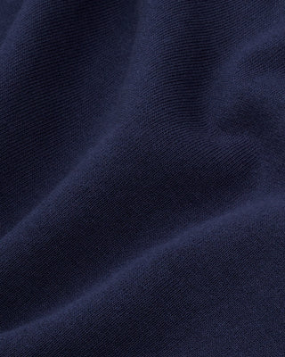 Wellness Ivy Zip Hoodie in Dark Navy/White—crafted in Portugal from 100% cotton, featuring a white WELLNESS print on the left chest and a zip-up hooded design.