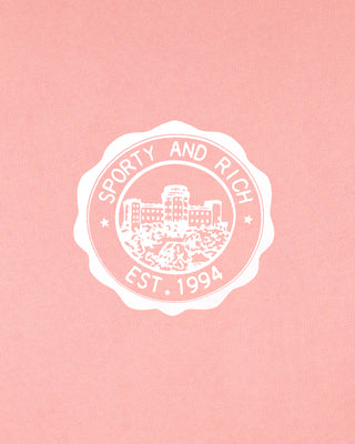 White logo with 'Sporty and Rich' text on a pink background