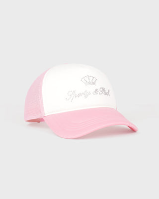 Pink and white cap with decorative elements on a light gray background