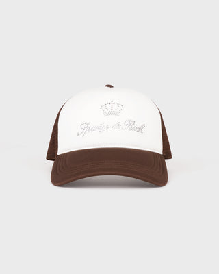 Brown and white cap with embroidered design on a light gray background