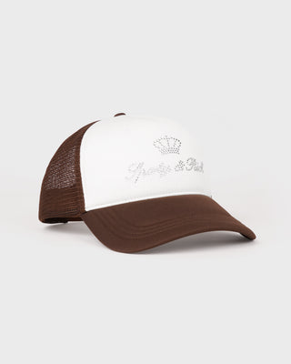 Brown and white cap with a logo on a light gray background