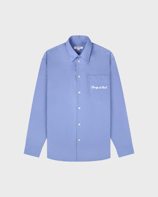 Light blue shirt with a brand logo on a white background