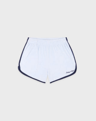 White shorts with navy trim on a light gray background