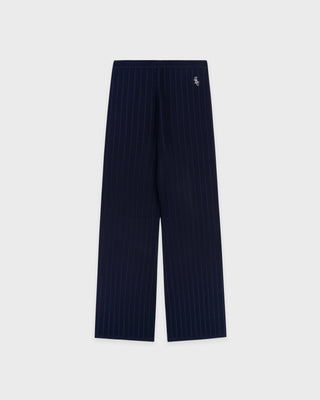 Navy ribbed pants on a light gray background