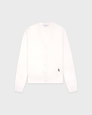 White long-sleeve shirt with a small logo on a light gray background