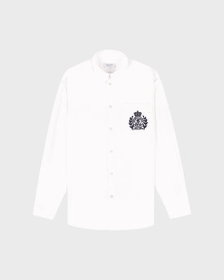 White shirt with a black emblem on a light gray background