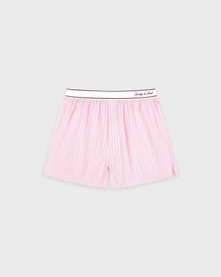 Pink striped boxer shorts with a black waistband on a light gray background