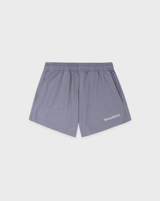Gray shorts with a brand logo on a light gray background