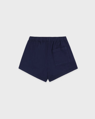 HWCNY Disco Short in Dark Navy/White is made from athletic cotton fleece, features an elastic waistband, and has the Sporty & Rich logo printed in white on the lower left leg. Made in the USA.