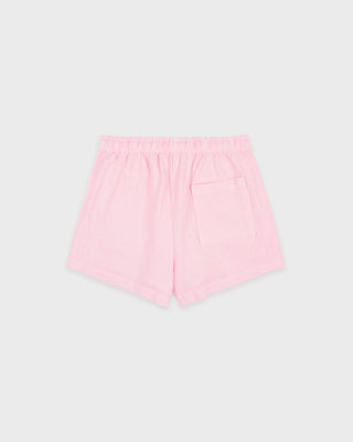 The Fitness 94 Disco Short in Laffy/White features light pink cotton fleece, an elastic waistband, and a Sporty & Rich logo on the bottom right leg. Made in the USA, it is displayed on a gray background.